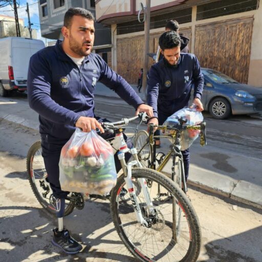 Gaza. Alaa and Haitham, another Sunbirds teammate, prepare to deliver aid parcels on their bikes to IDP tents in Rafah, on February 1, 2024