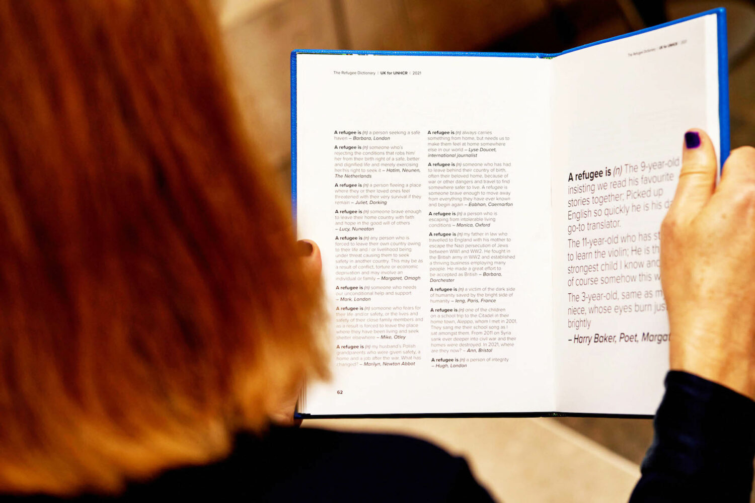 A woman reading The Refugee Dictionary